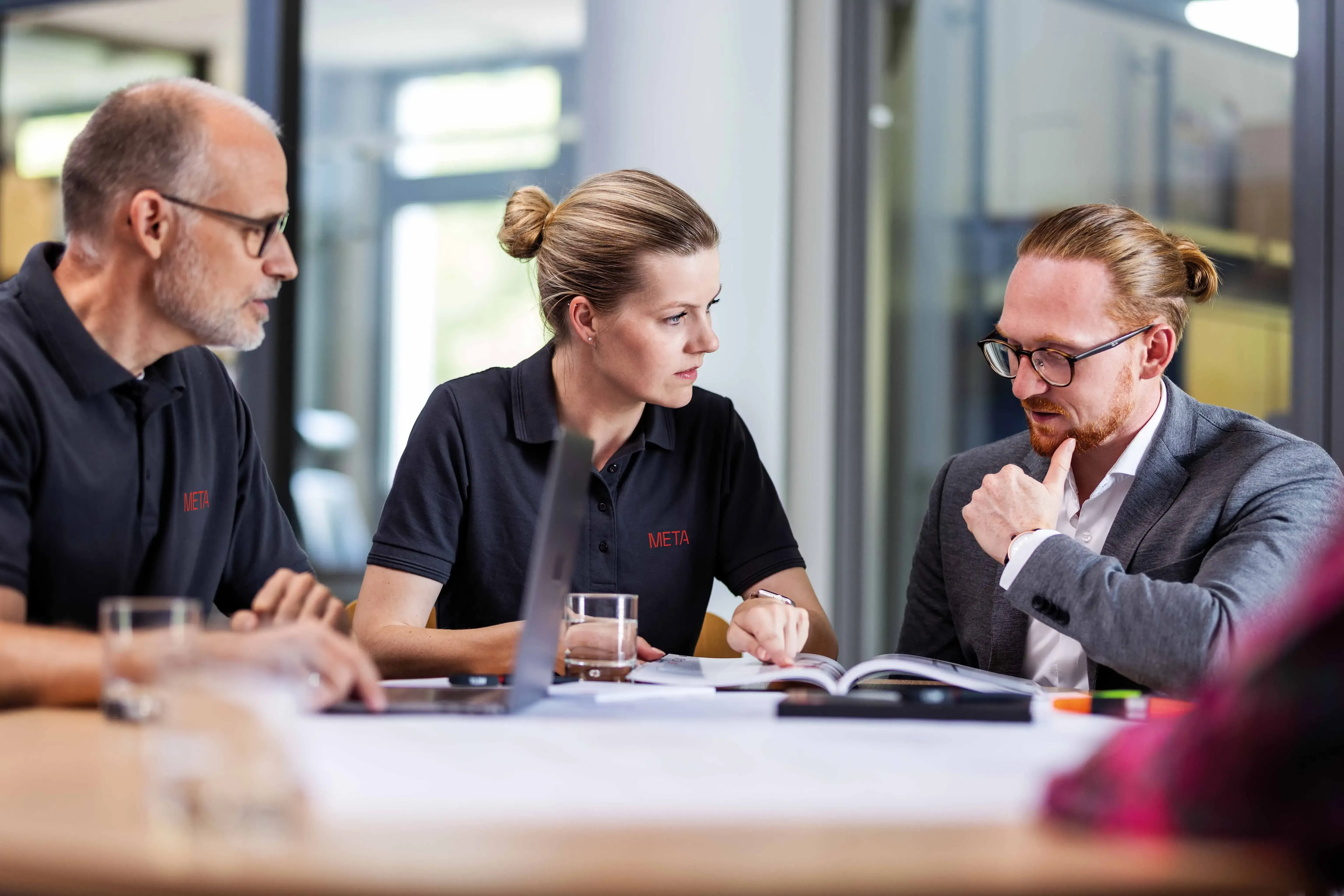 People discussing the new logo
